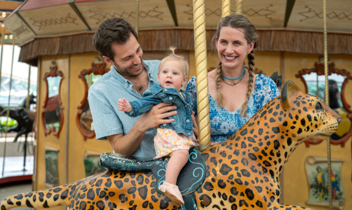 Family with toddler at the Lincoln Park Zoo AT&T Endangered Species Carousel